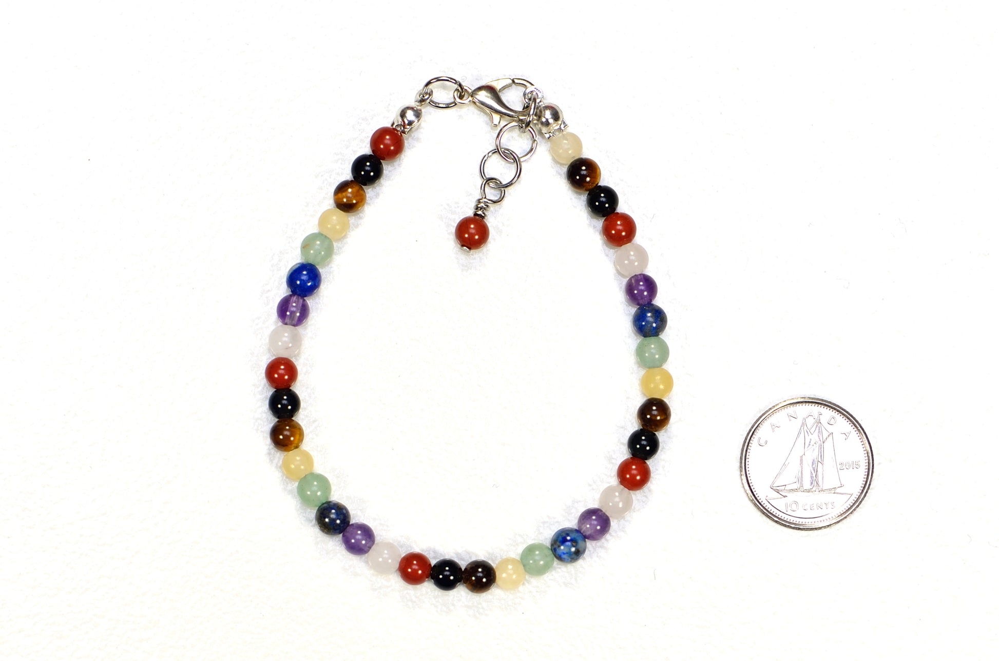 4mm Chakra Gemstone Anklet beside a dime.