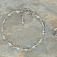 4mm Clear Quartz Link Bracelet beside a dime.