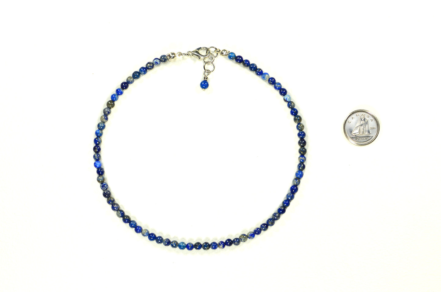 4mm Natural Lapis Lazuli Choker Necklace beside a dime.