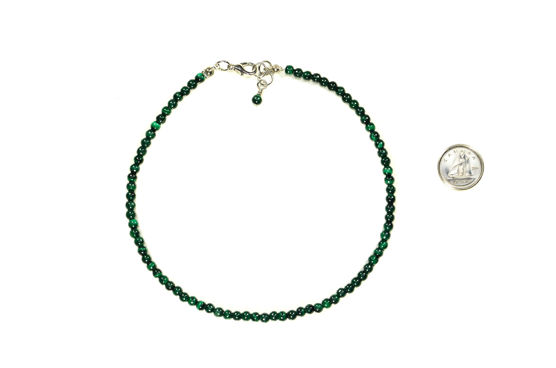 4mm Natural Malachite Choker Necklace beside a dime.
