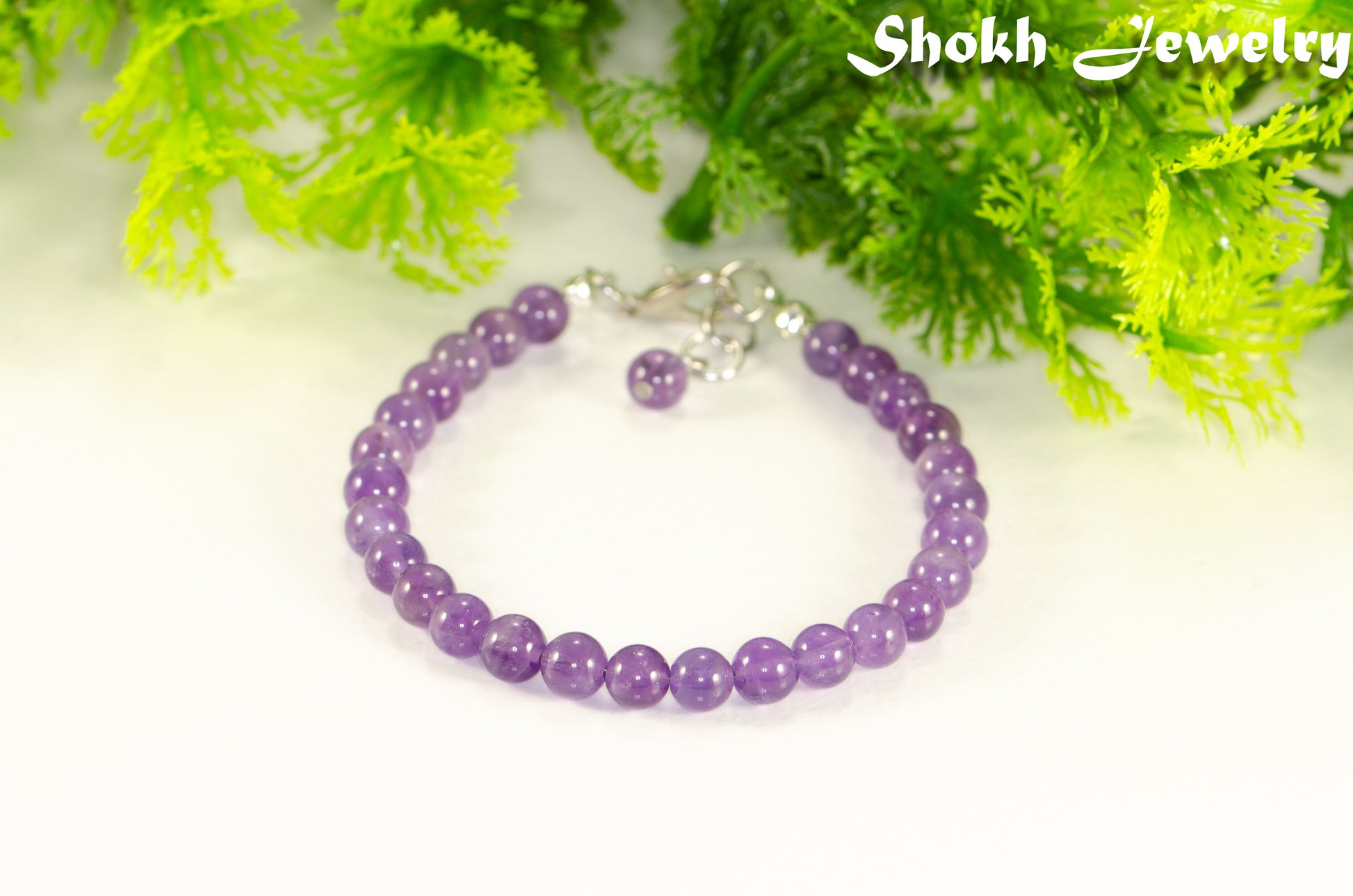 6mm Amethyst Crystal Bracelet with clasp and a dangle.