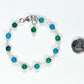6mm Blue Jade Link Bracelet beside a dime.