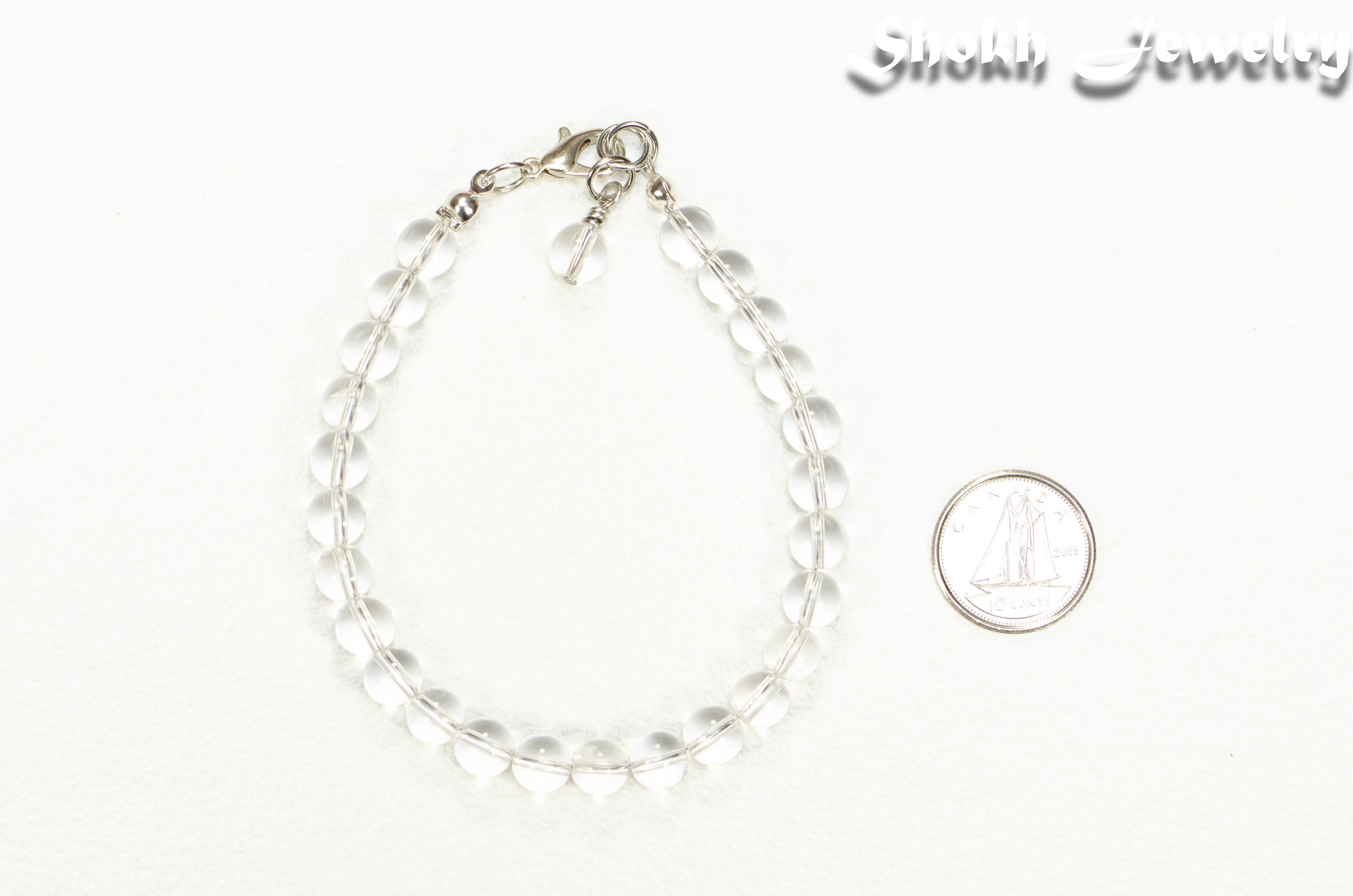 6mm Clear Quartz Beaded Anklet beside a dime.