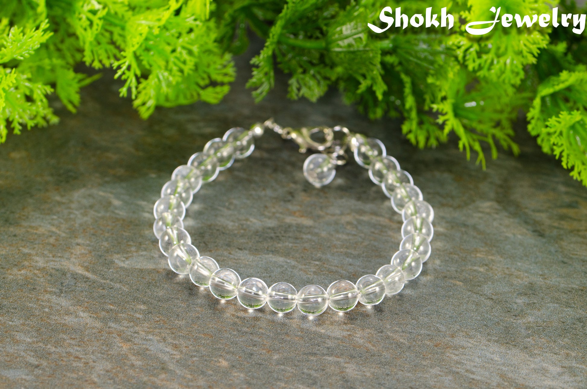 6mm Clear Quartz Beaded Bracelet with clasp and a dangle.
