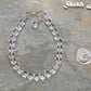 6mm Clear Quartz Beaded Bracelet beside a dime.