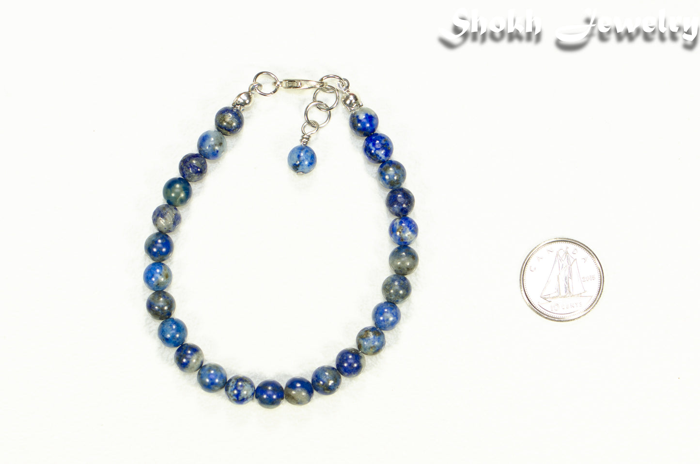 6mm Lapis Lazuli Beaded Bracelet beside a dime.