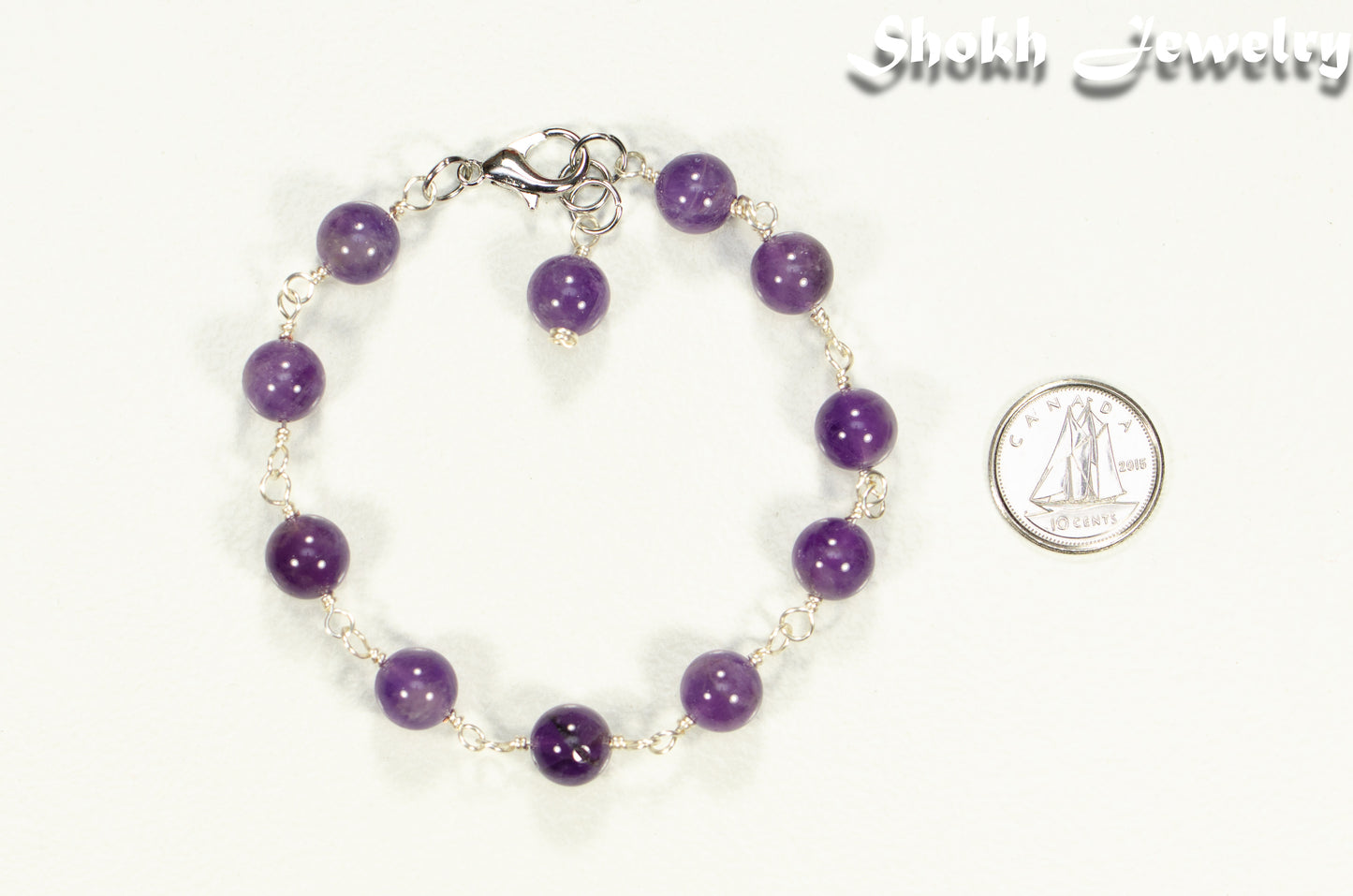 8mm Amethyst Link Chain Anklet beside a dime.