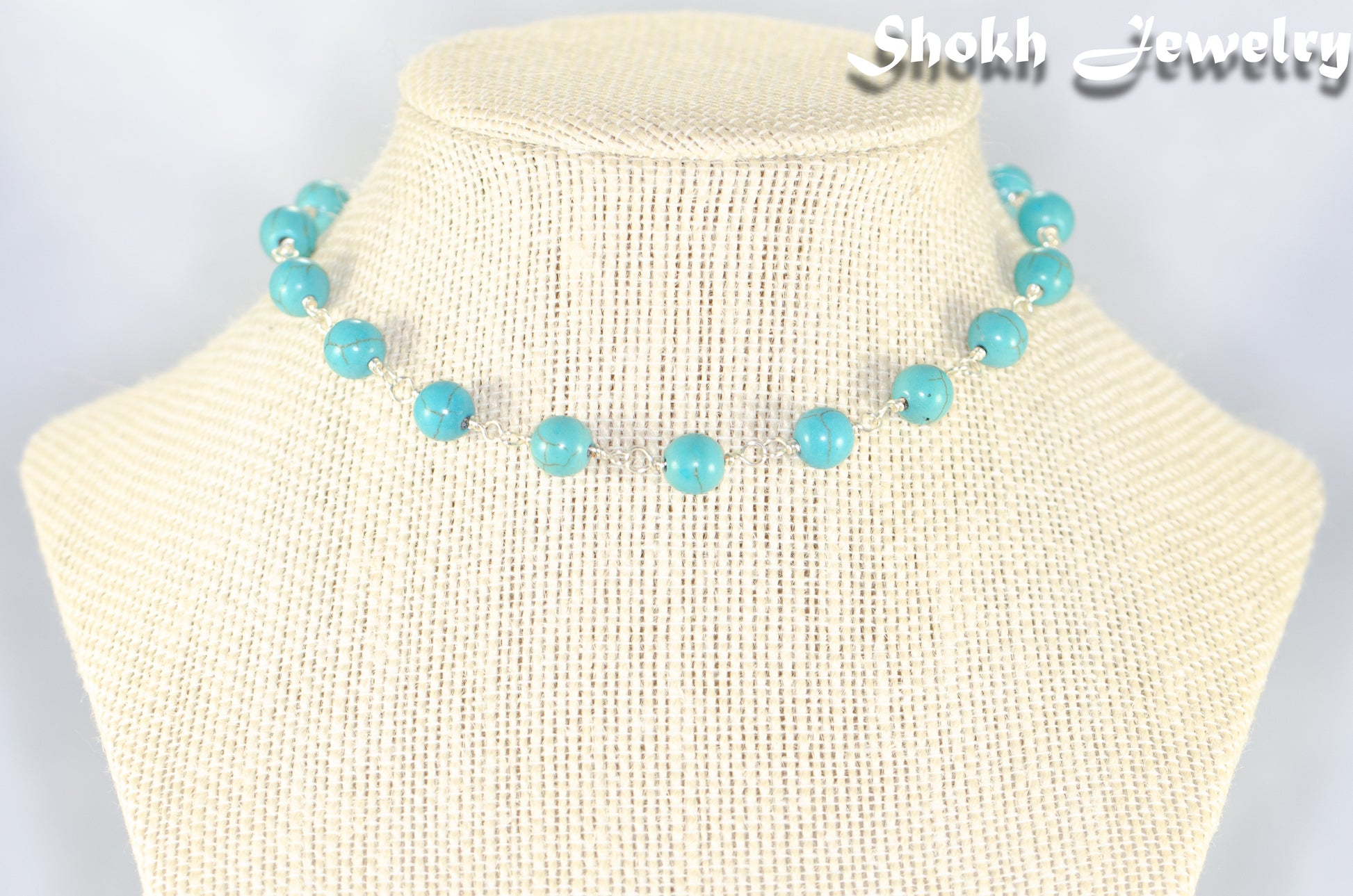 8mm Turquoise Howlite Link Choker Necklace displayed on a bust.