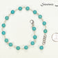 8mm Turquoise Howlite Link Choker Necklace beside a dime.