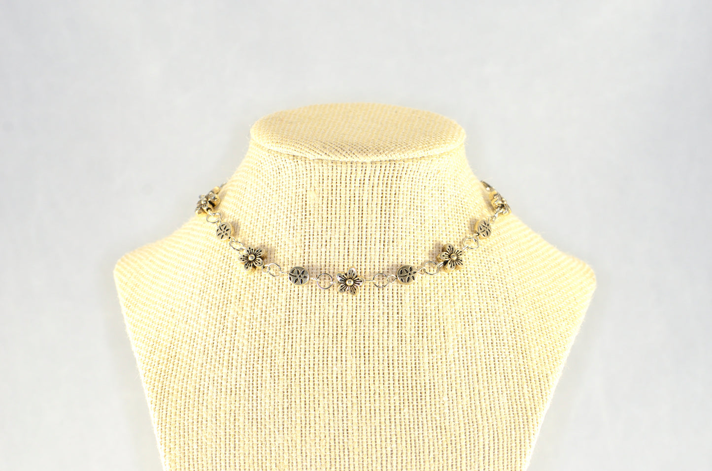Chunky Tibetan Silver Flower Choker Necklace displayed on a bust.