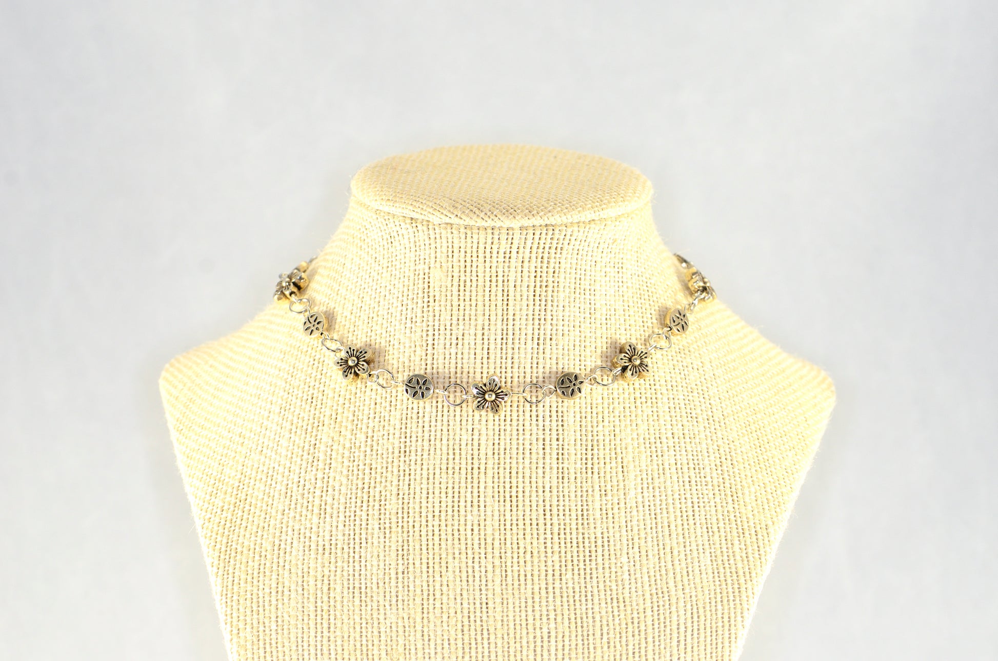 Chunky Tibetan Silver Flower Choker Necklace displayed on a bust.