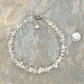 Clear Quartz Crystal Chip Anklet beside a dime.