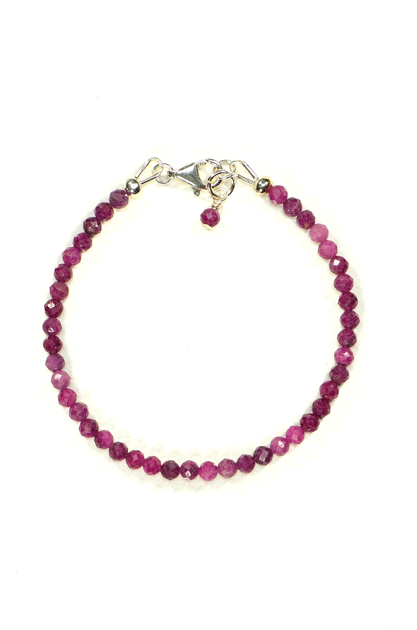 Top view of Faceted Ruby Bracelet with Sterling Silver Clasp.