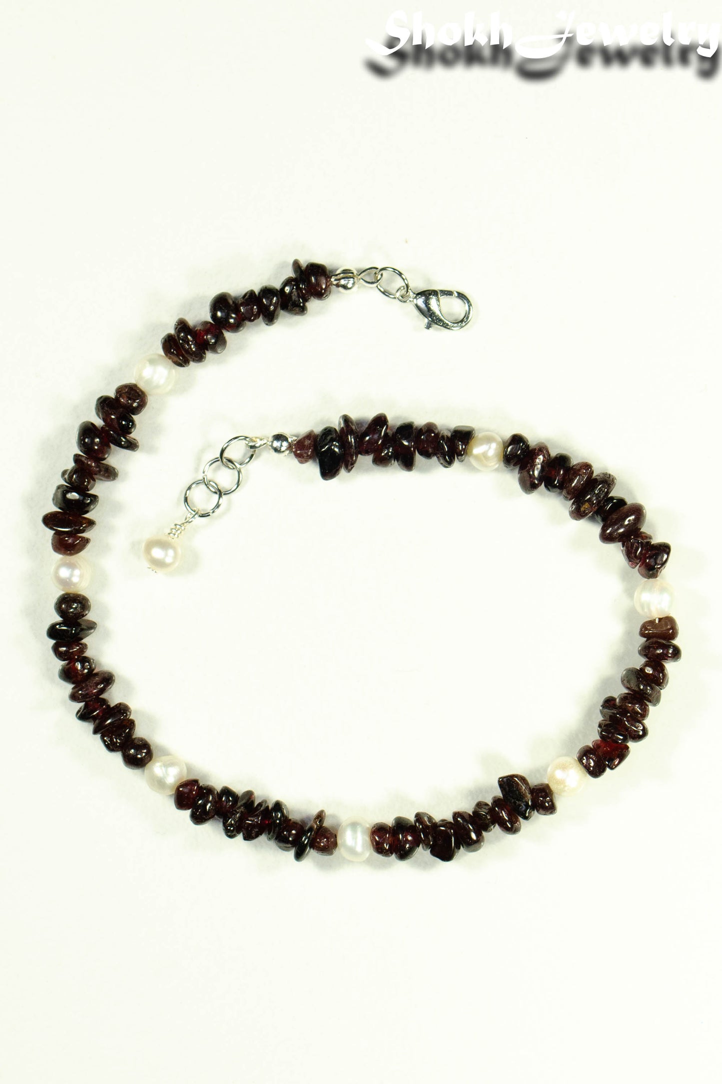 Top view of Freshwater Pearls and Garnet Crystal Chip Choker Necklace.