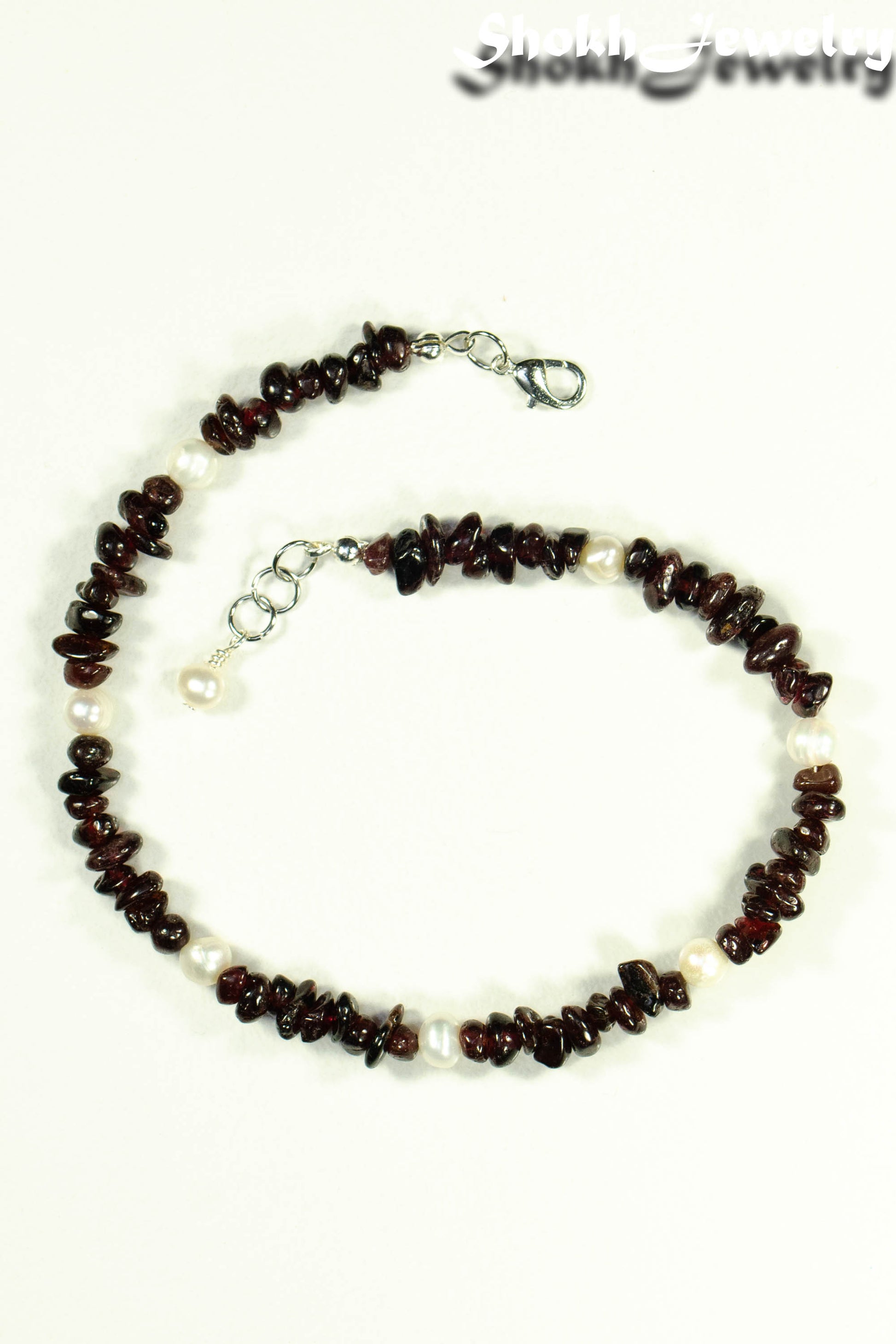 Top view of Freshwater Pearls and Garnet Crystal Chip Choker Necklace.