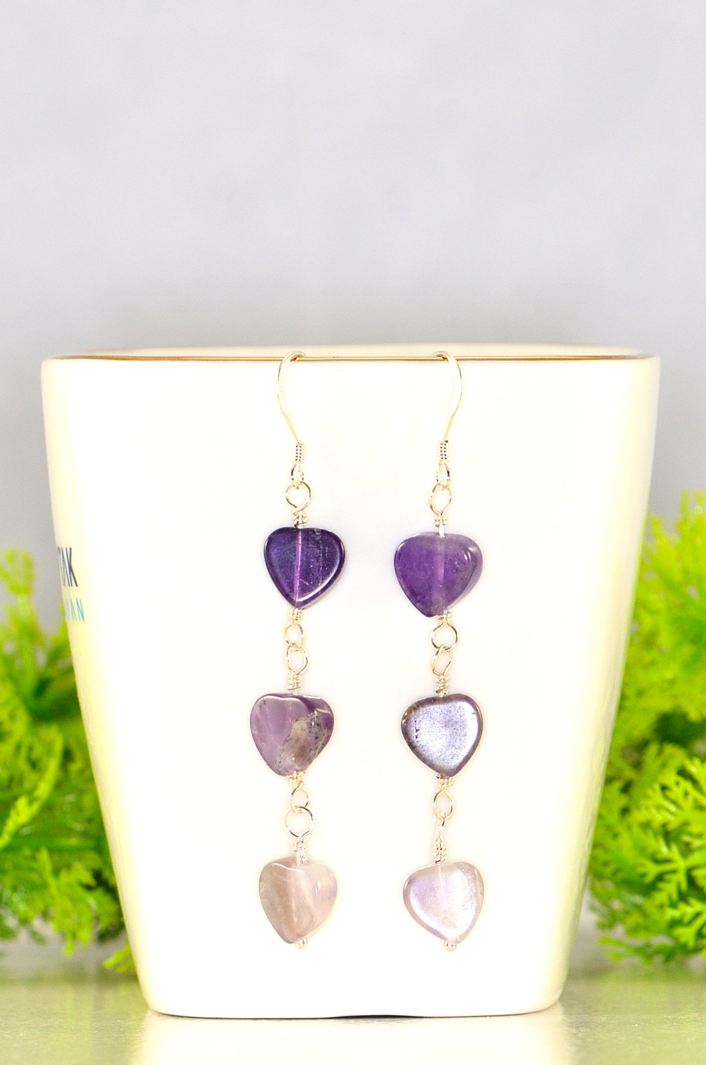 Close up of Natural Amethyst Heart Dangle Earrings.