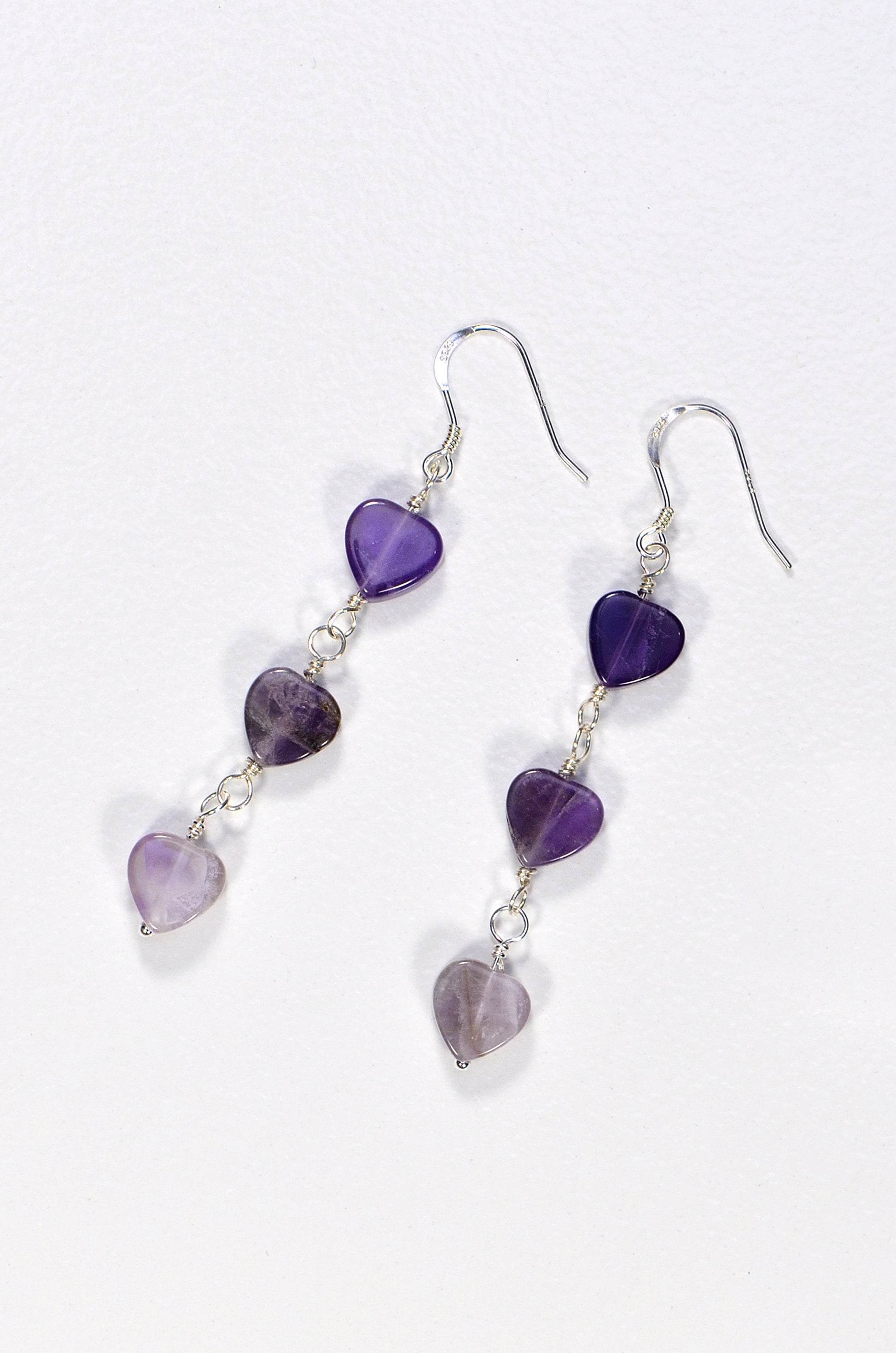Top view of Natural Amethyst Heart Dangle Earrings.