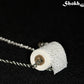 Close up of Miniature Toilet Paper Roll and Dainty Chain Choker Necklace.