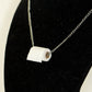 Miniature Toilet Paper Roll and Dainty Chain Choker Necklace displayed on a bust.