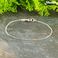 Silver Plated Dainty Chain Bracelet with a clasp.