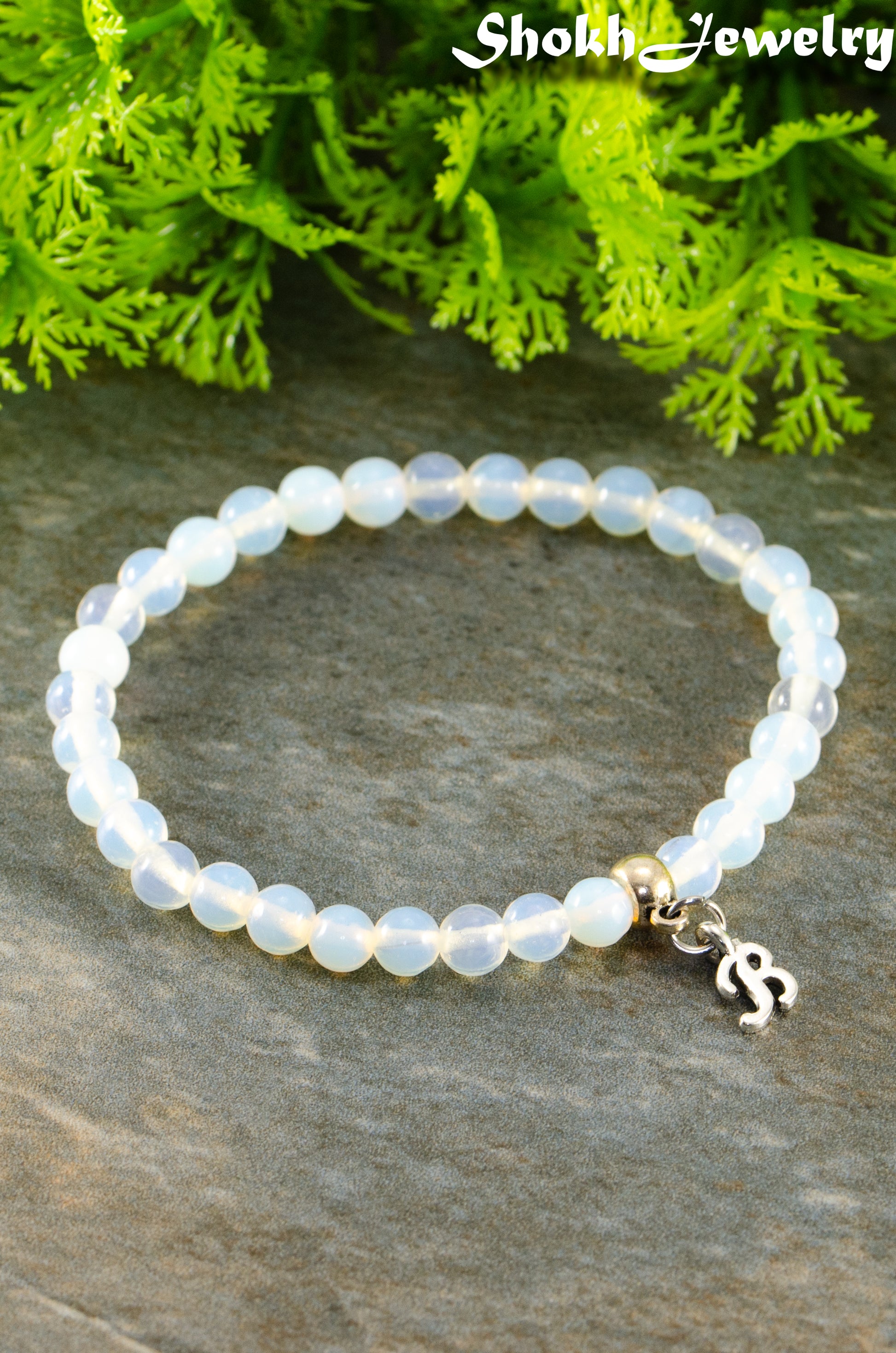 Close up of 6mm White Opal Bracelet with Initial.