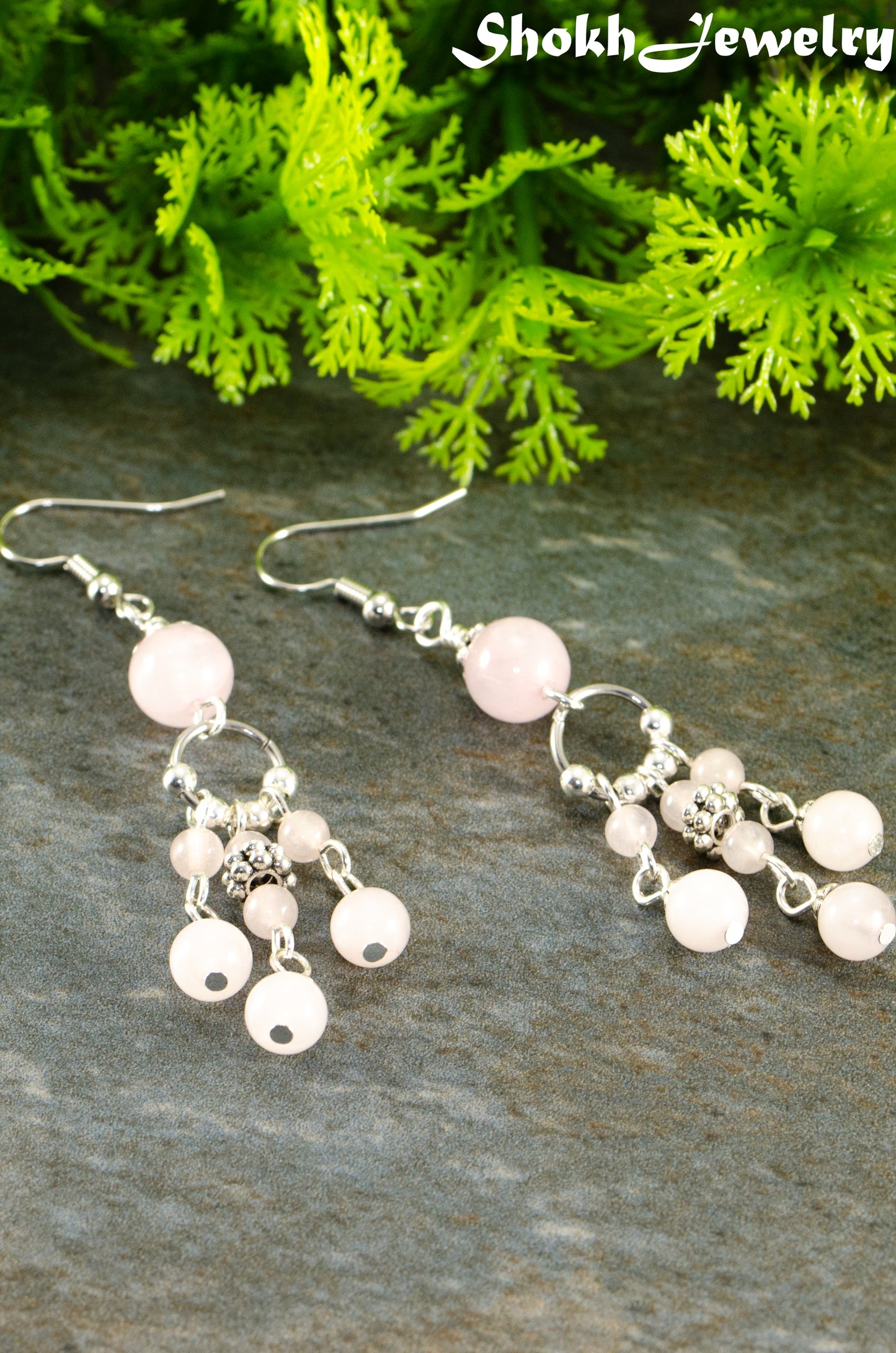 Close up of Statement Rose Quartz Chandelier Earrings.