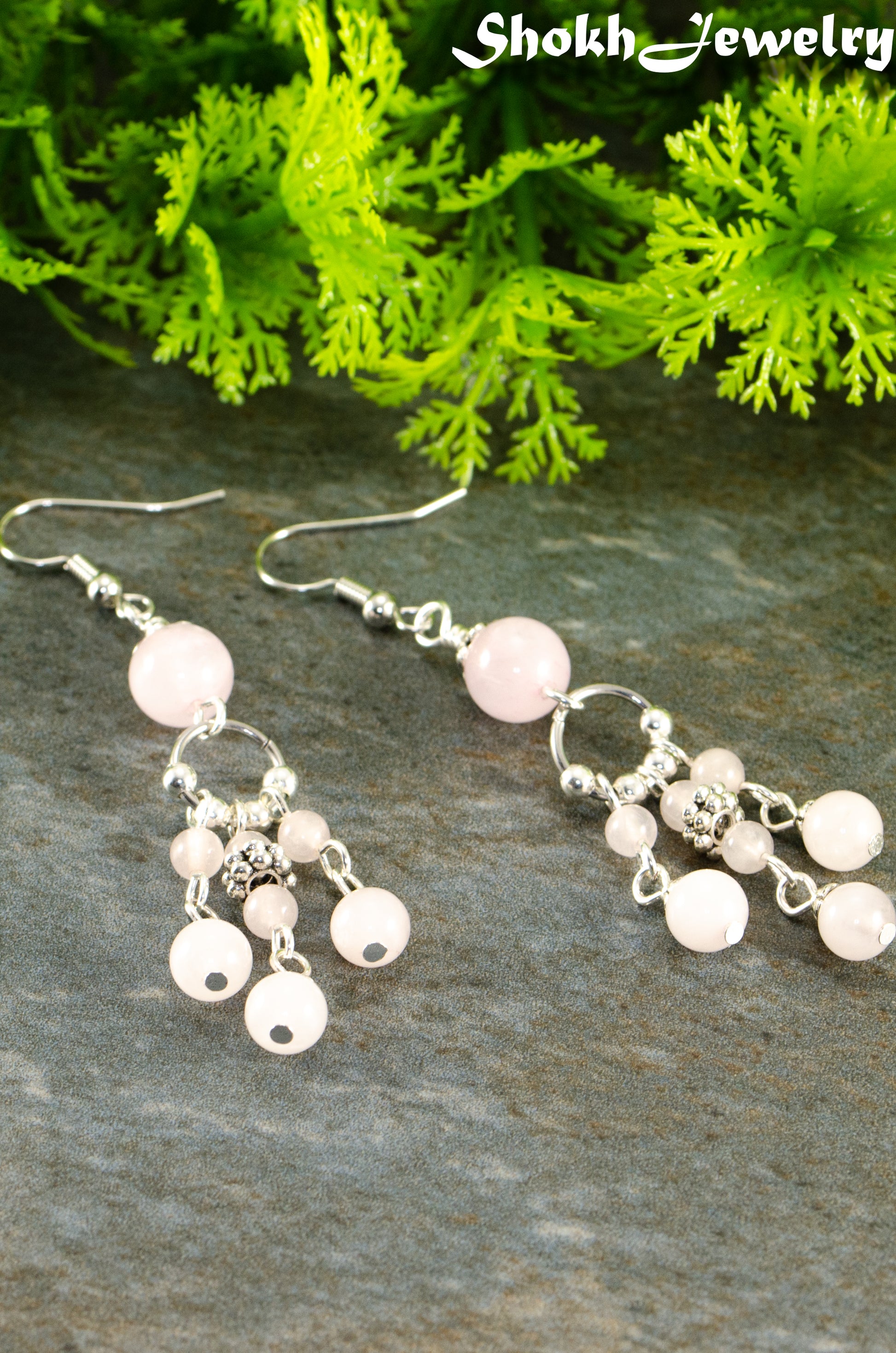 Close up of Statement Rose Quartz Chandelier Earrings.