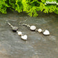 Close up of Grey Seashell and White Pearl Earrings.