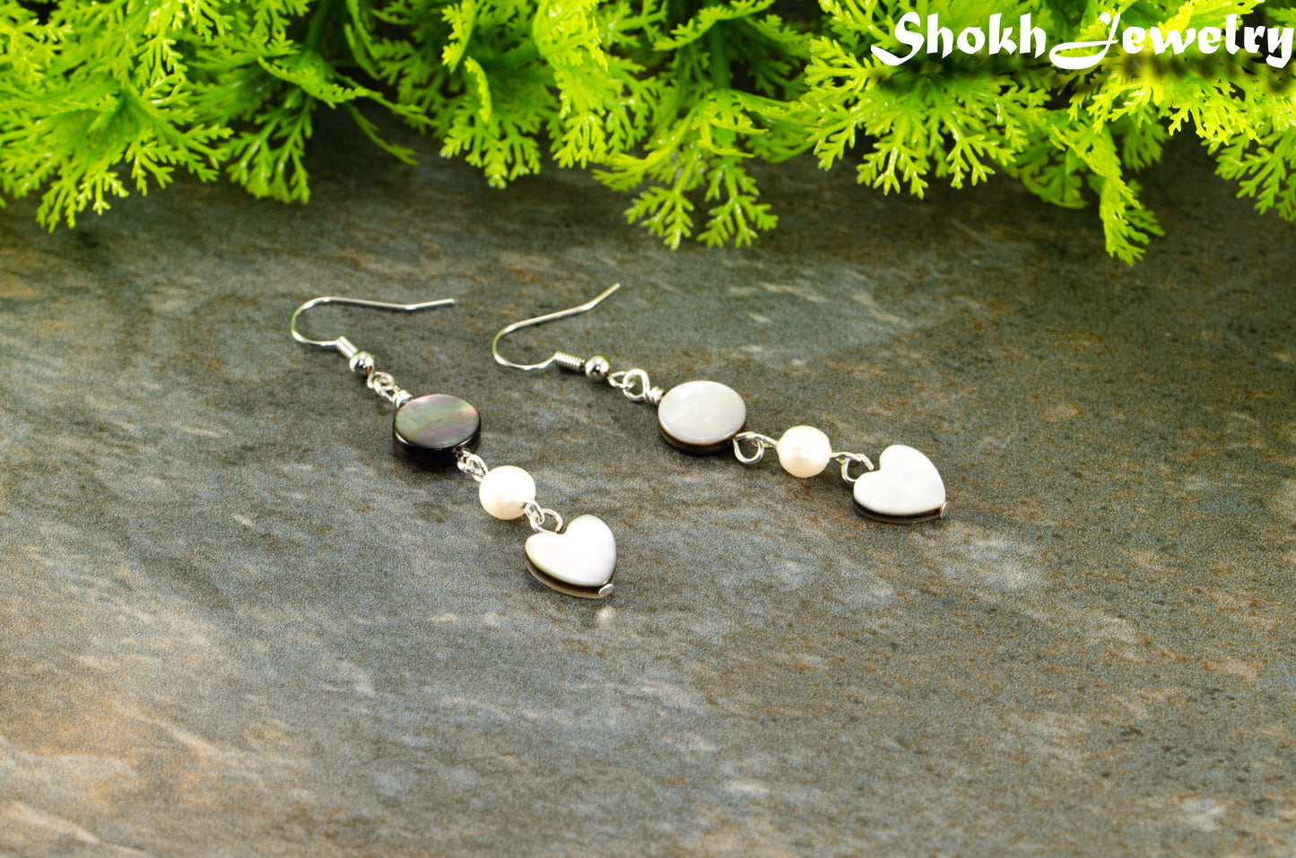 Close up of Grey Seashell and White Pearl Earrings.