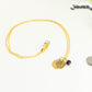 Gold Plated January Birth Flower Necklace with Garnet Birthstone Pendant beside a dime.