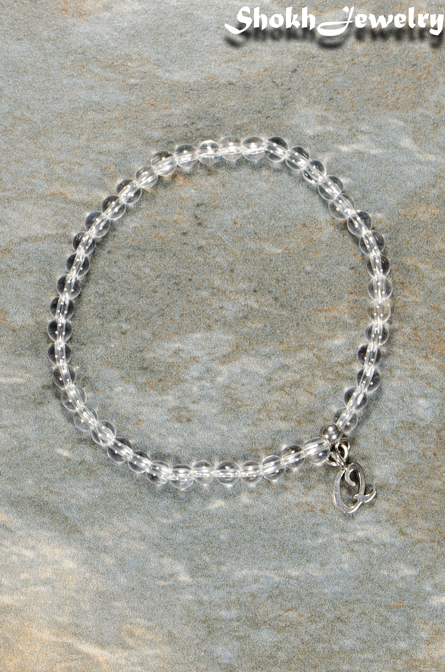 Top view of 4mm Clear Quartz Bracelet with Initial.