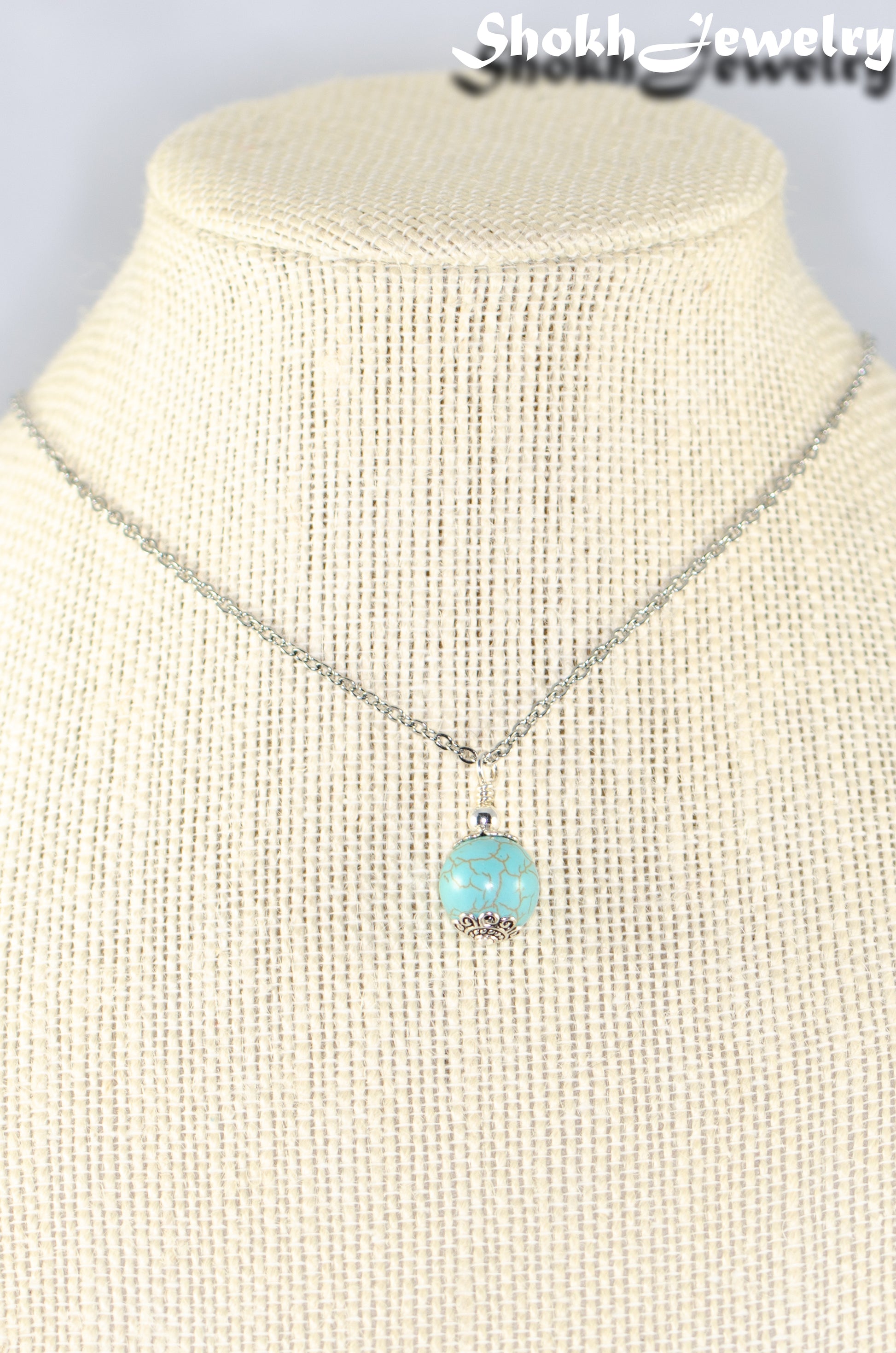 12mm Turquoise Howlite Pendant Necklace displayed on a bust.