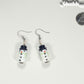 Snowman Glass Bead Earrings beside a dime.