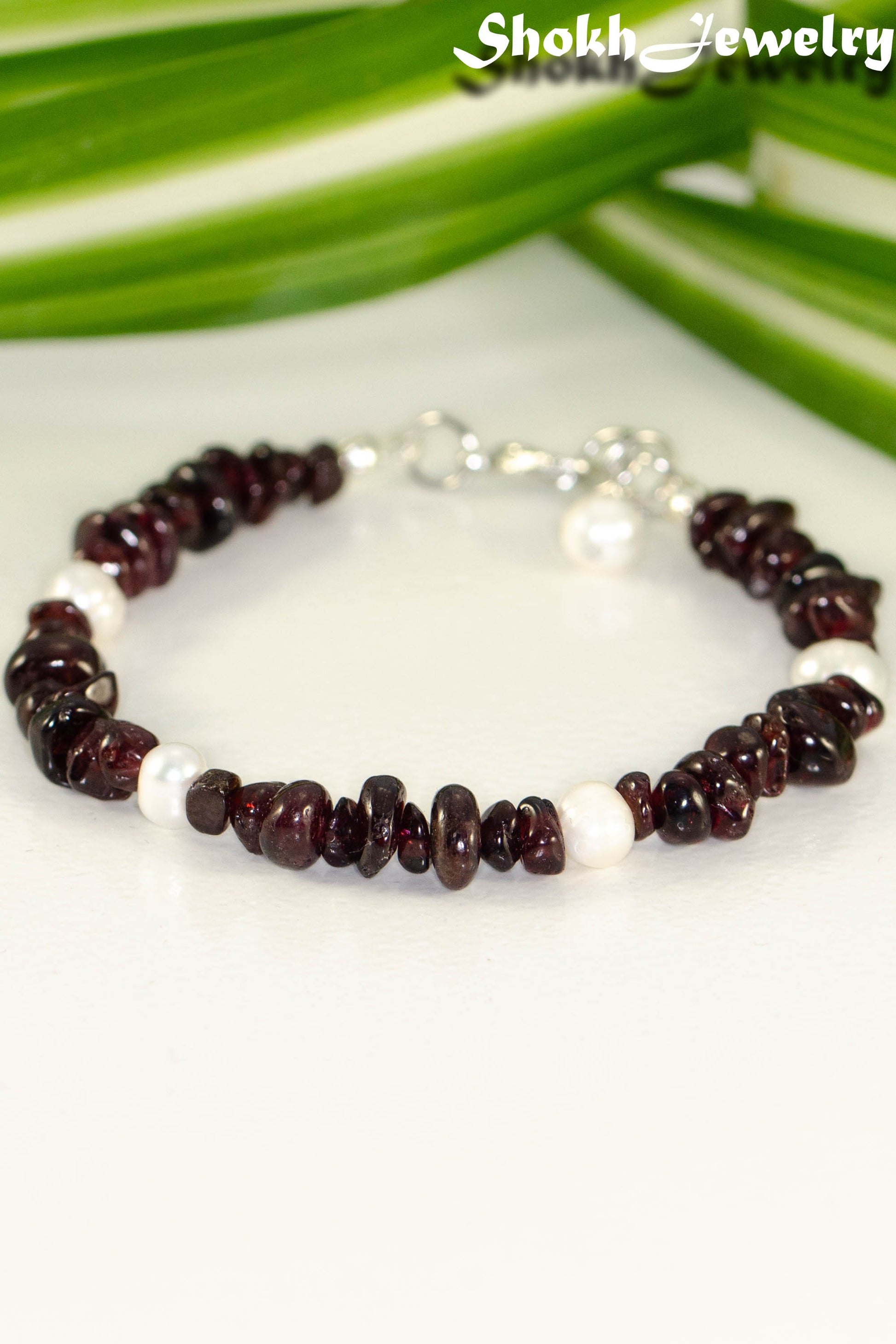 Close up of Natural Garnet Crystal Chip and Pearls Bracelet.