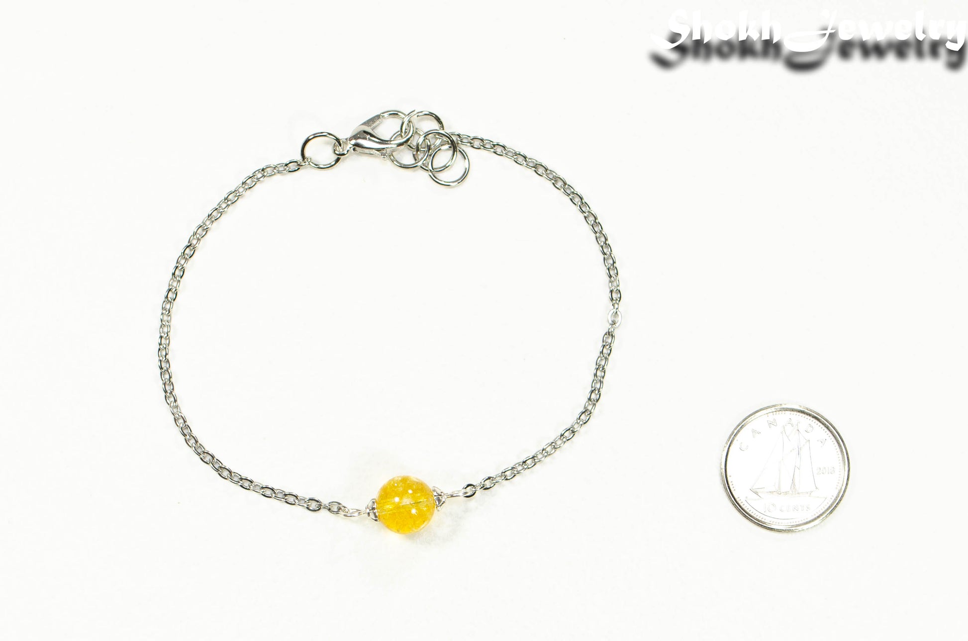 8mm Citrine and Chain Anklet beside a dime.