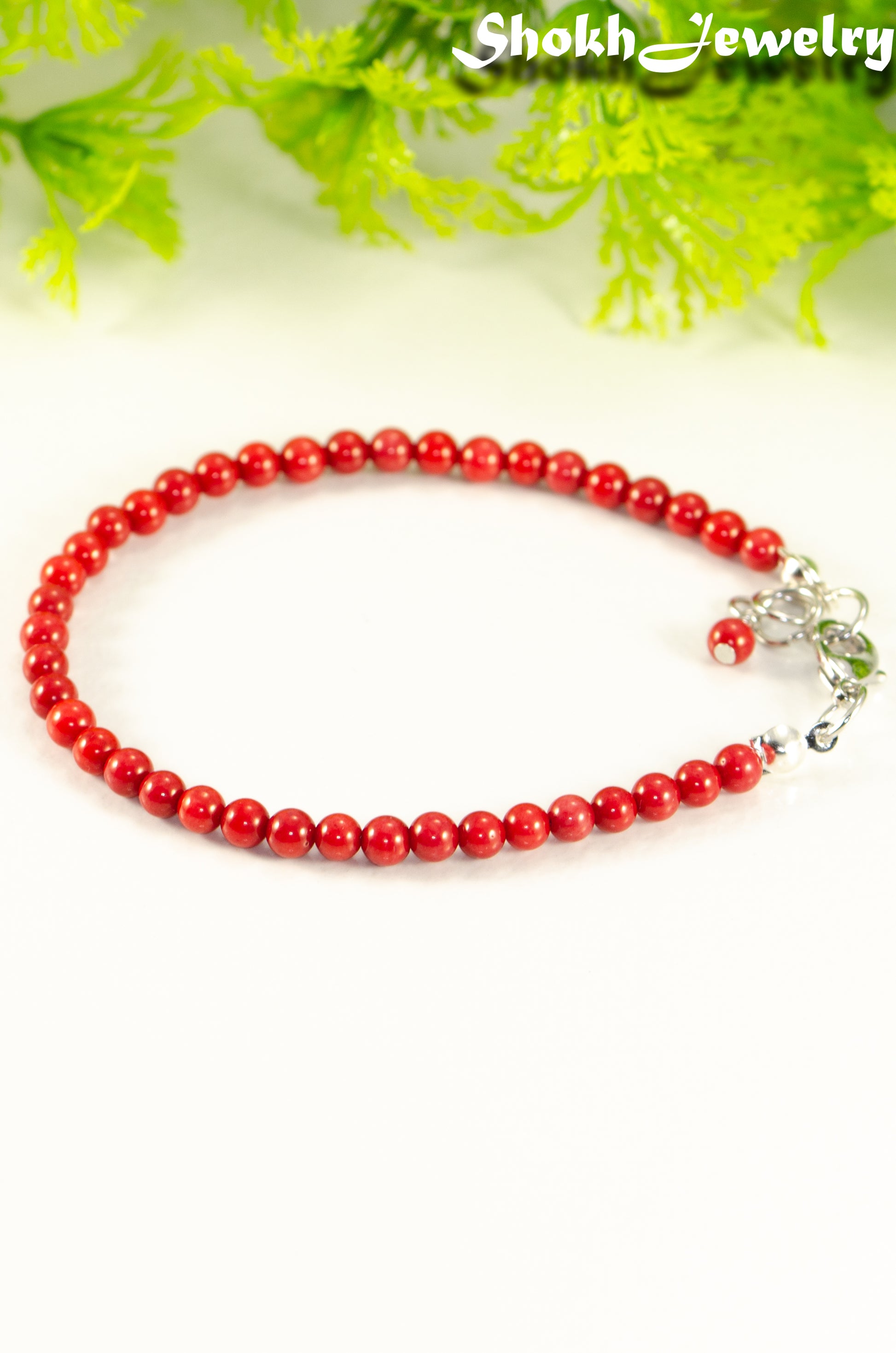 Close up of 4mm Natural Red Coral Bracelet with Clasp.