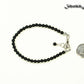4mm Black Onyx Stone Bracelet with Clasp beside a dime.