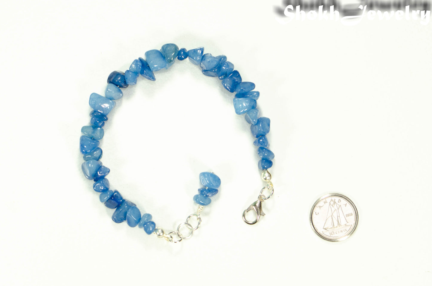 Natural Blue Quartzite Crystal Chip Bracelet beside a dime.