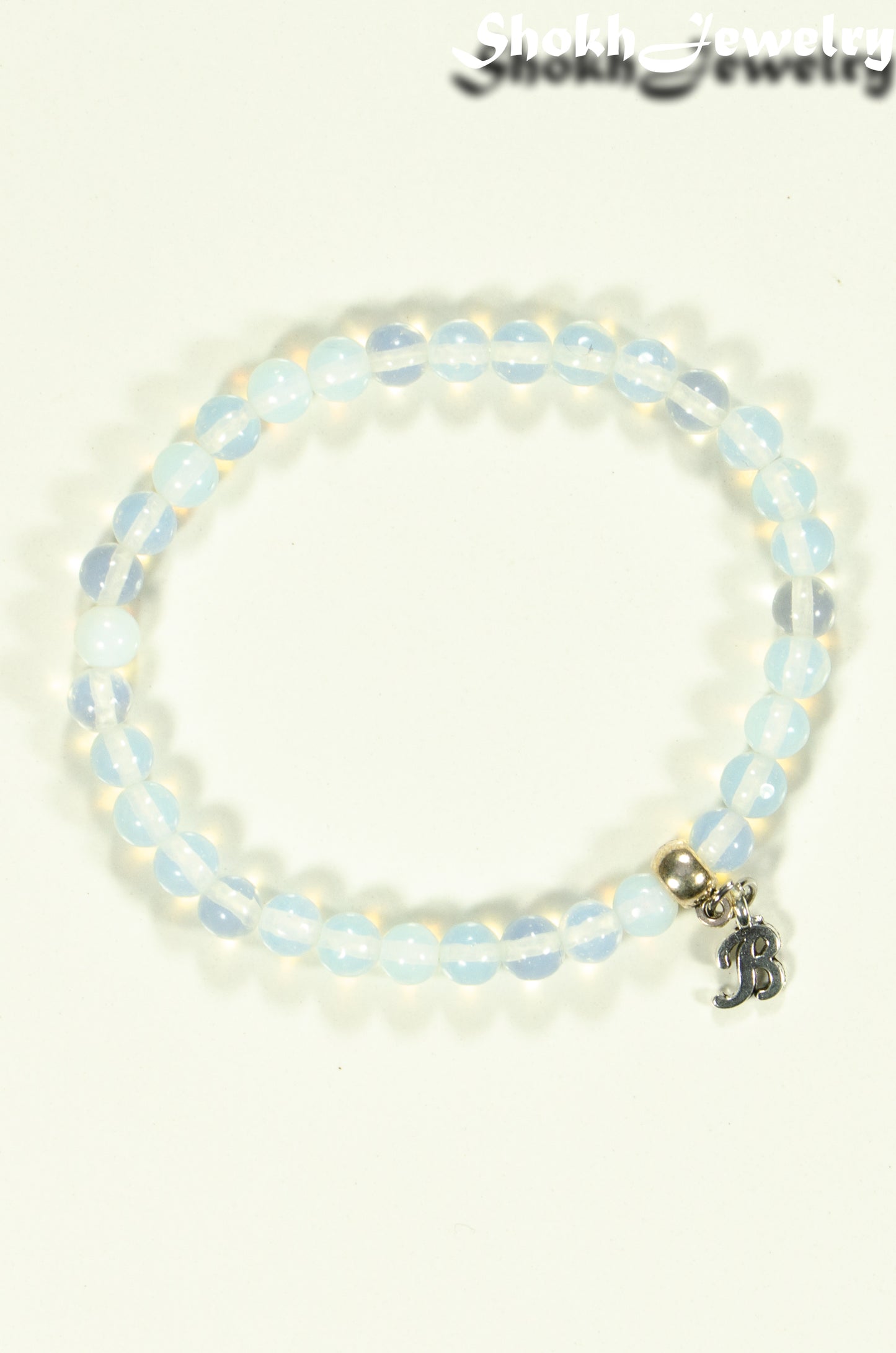Top view of 6mm White Opal Bracelet with Initial.