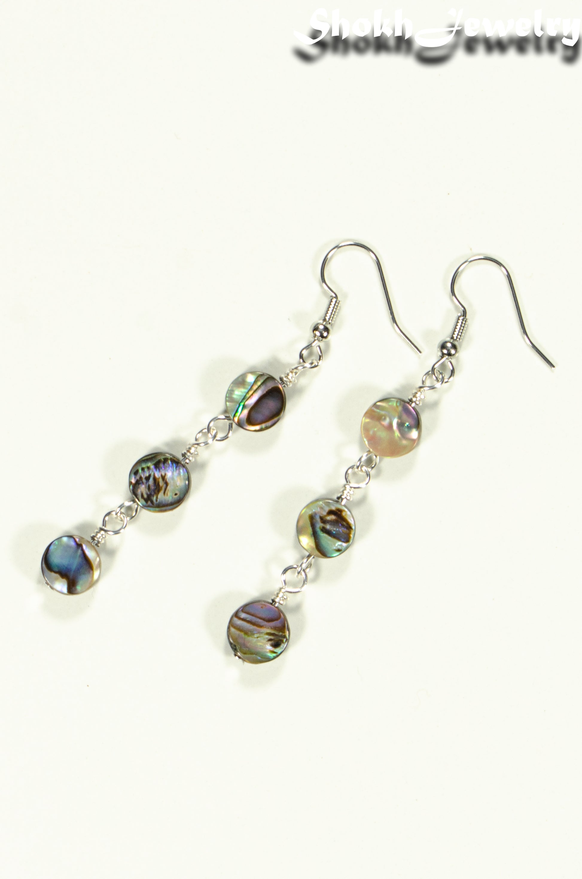 Top view of Elegant Long Natural Abalone Shell Earrings.