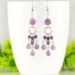 Statement Amethyst Crystal Chandelier Earrings displayed on a coffee mug.