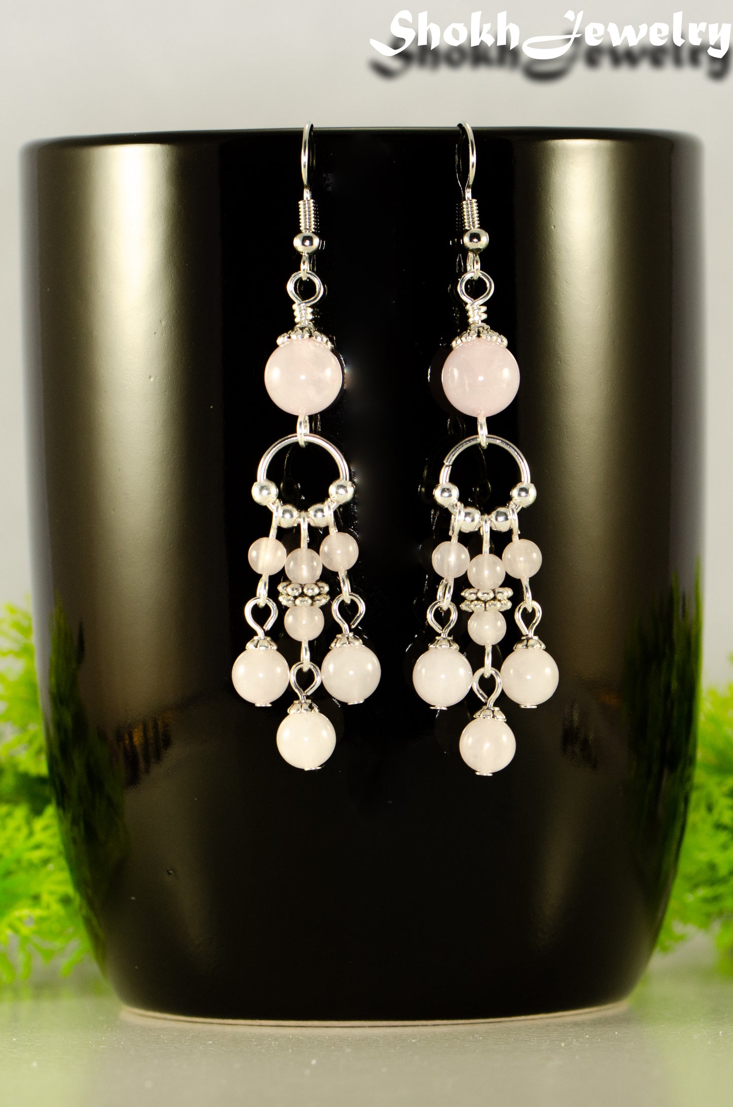 Close up of Statement Rose Quartz Chandelier Earrings.