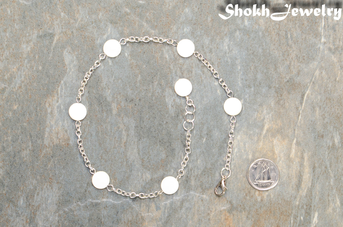 Seashell and Dainty Chain Choker Necklace beside a dime.