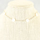 Close up of Seashell and Dainty Chain Choker Necklace.