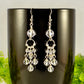 Close up of Statement Clear Quartz Chandelier Earrings.