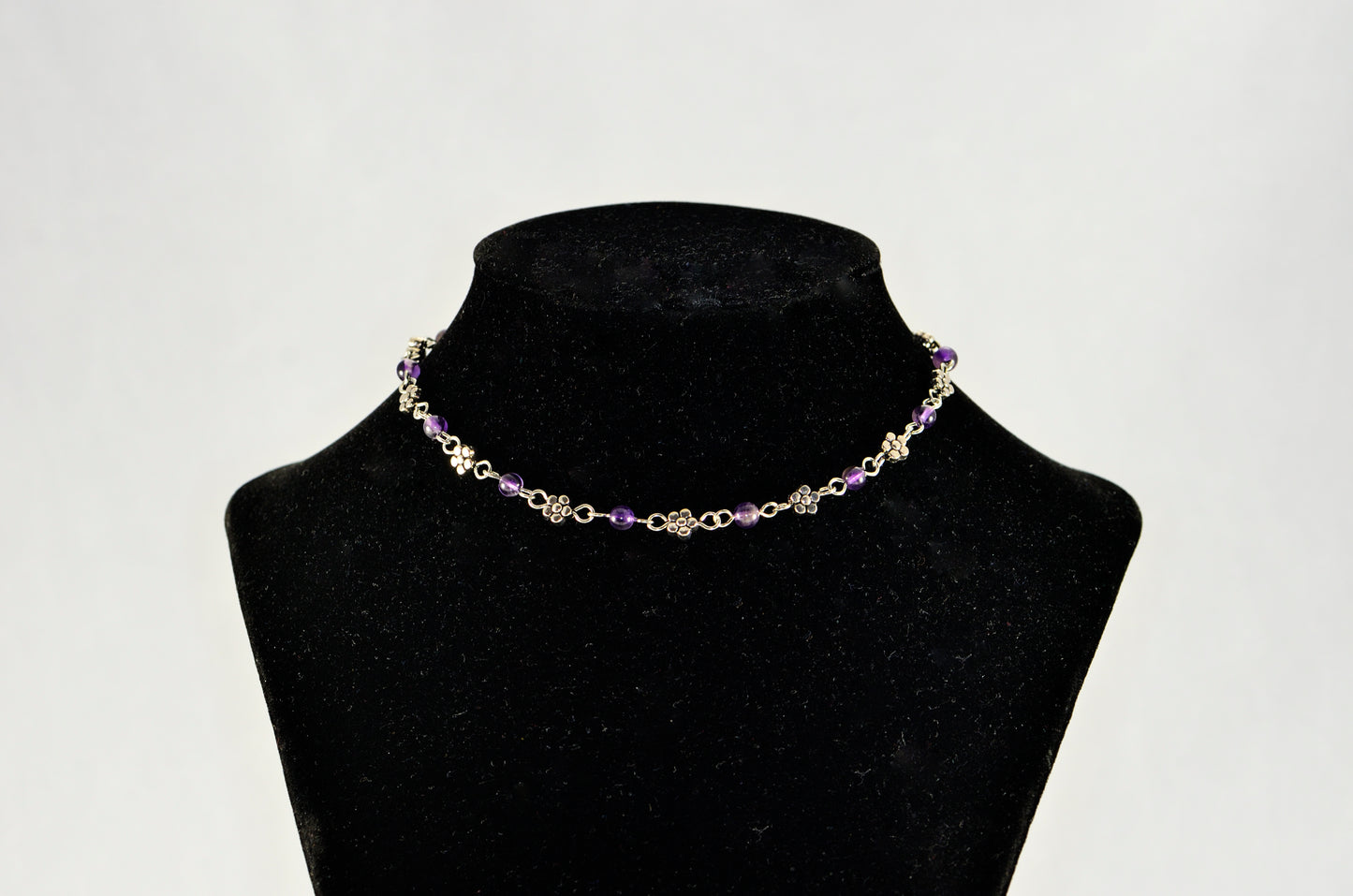 Tibetan Silver Flower and Amethyst Choker Necklace displayed on a bust.