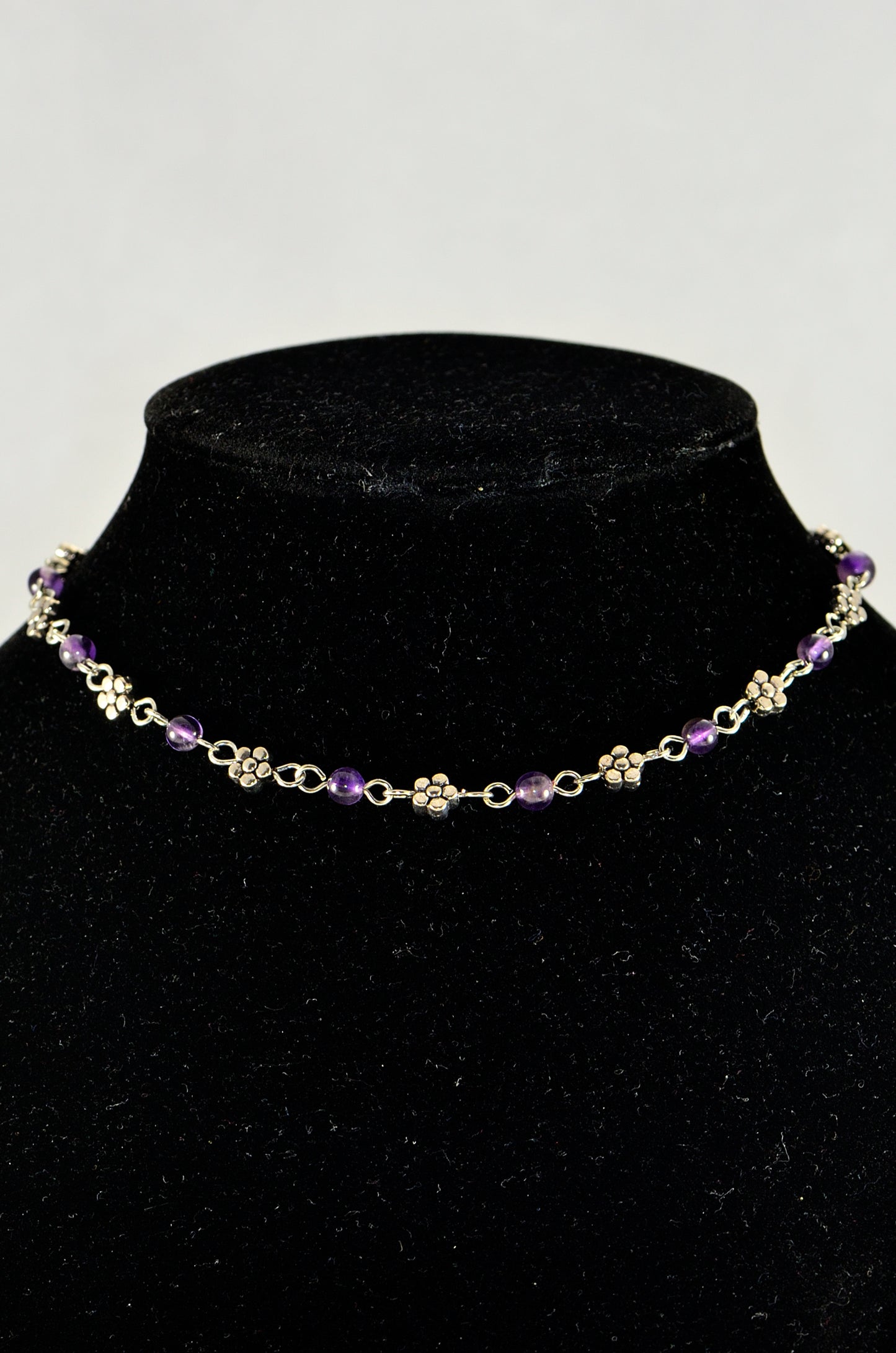 Close up Tibetan Silver Flower and Amethyst Choker Necklace.
