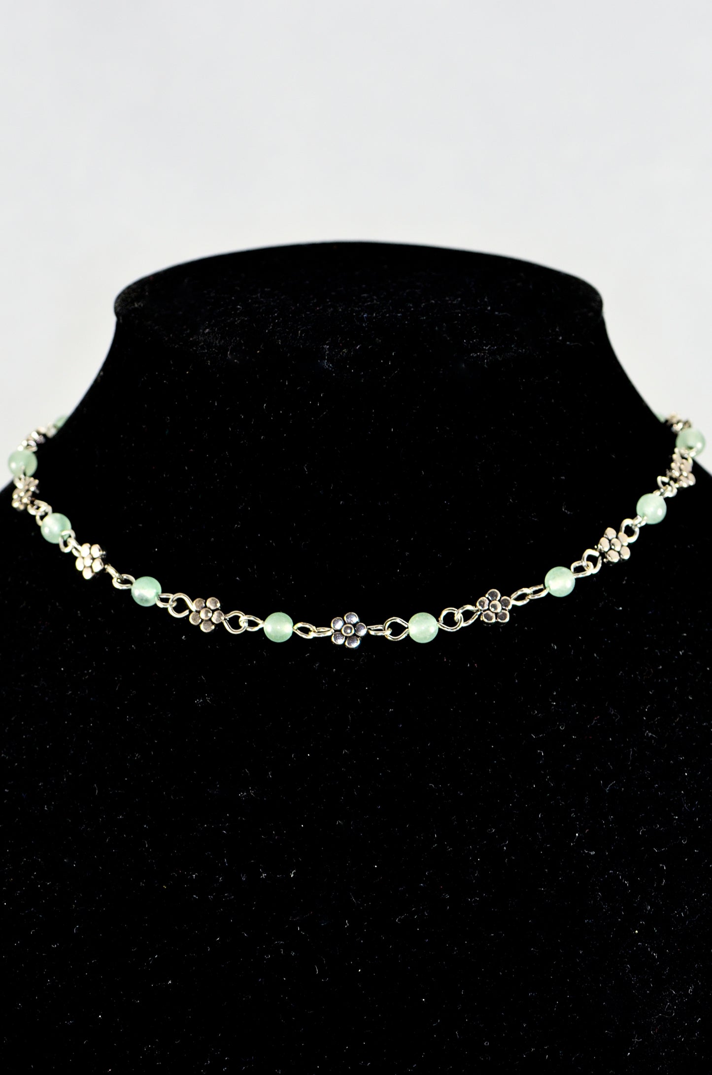 Close up of Tibetan Silver Flower and Green Aventurine Choker Necklace.