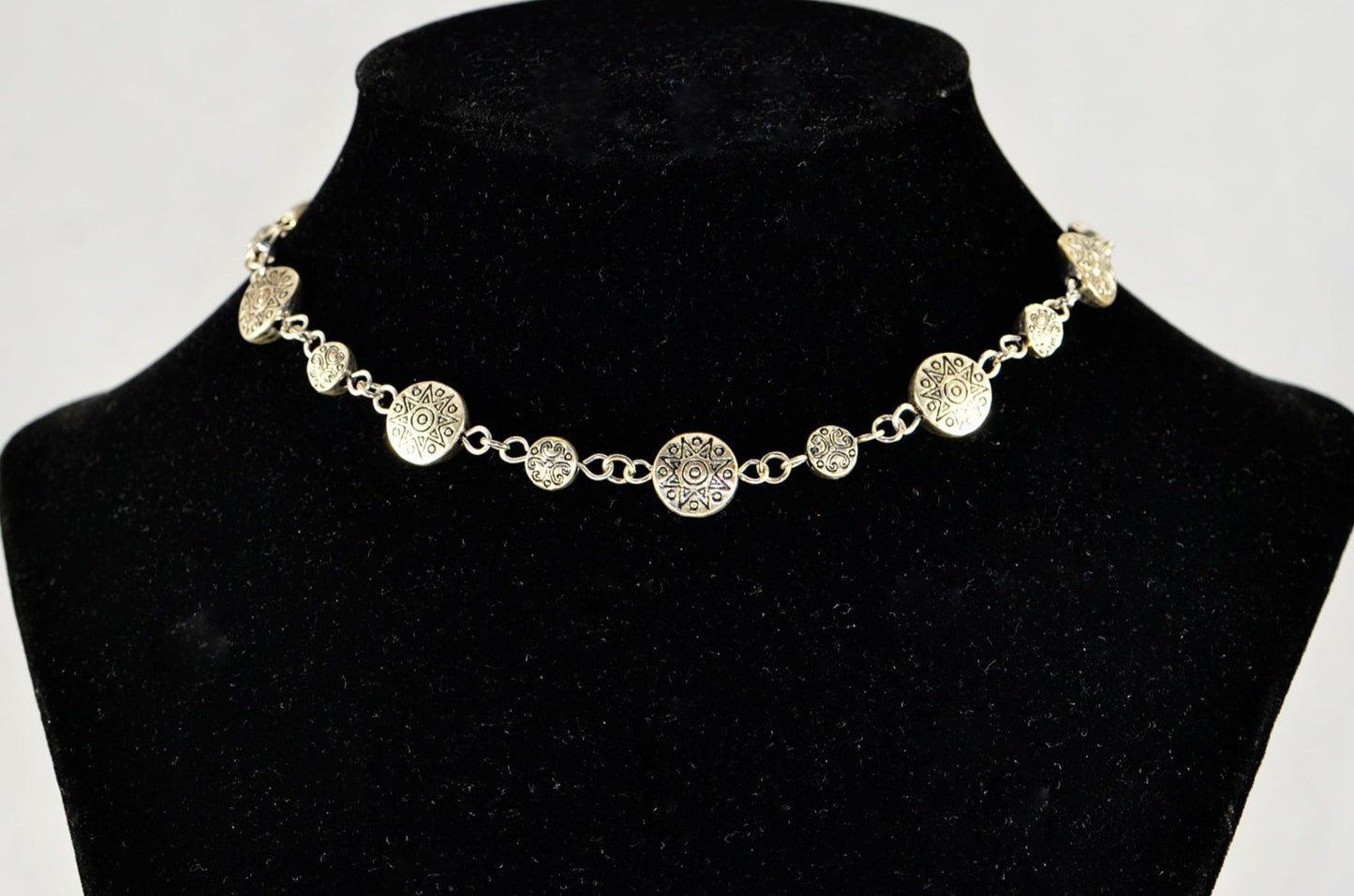 Tibetan Silver Star Sun and Moon Choker Necklace displayed on a bust.