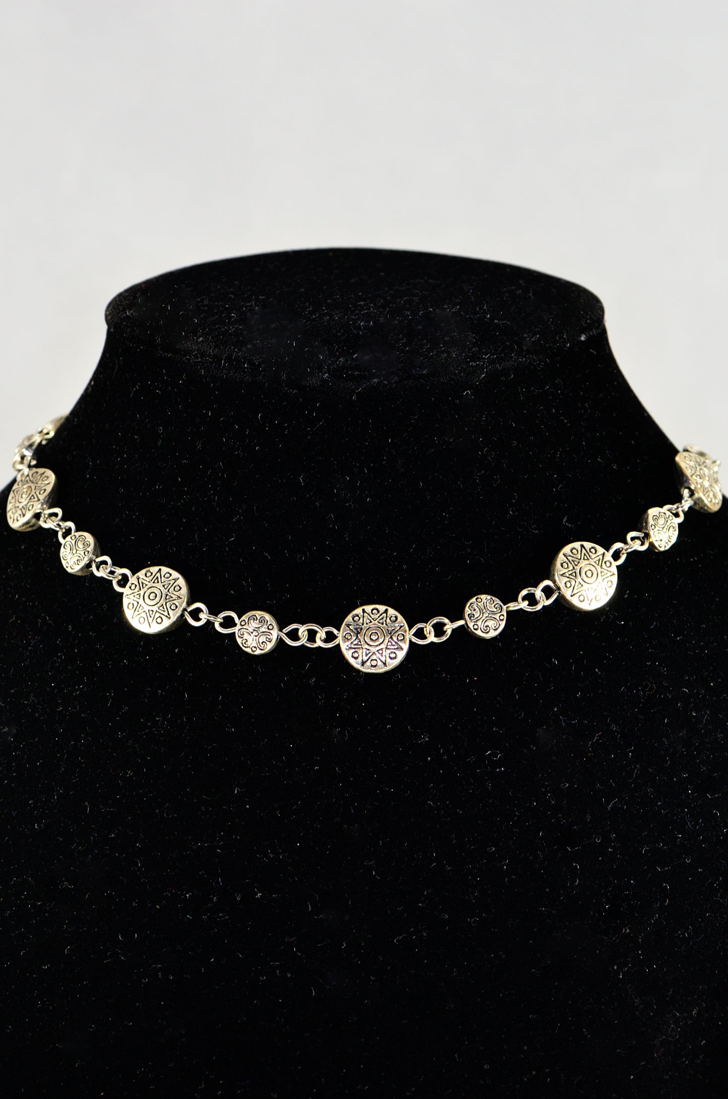 Close up of Tibetan Silver Star Sun and Moon Choker Necklace.
